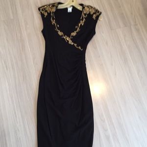 Black dress with gold beading.